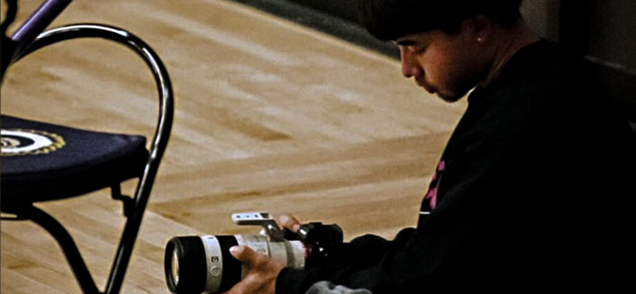 Travis takes video for Haskell athletes.