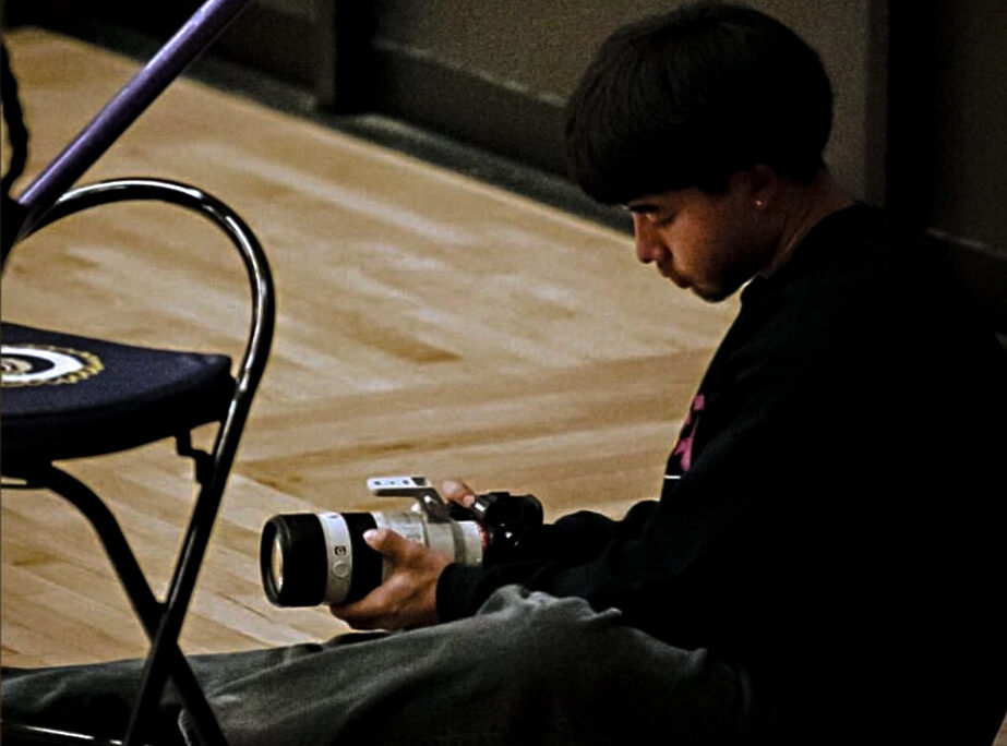 Travis takes video for Haskell athletes.